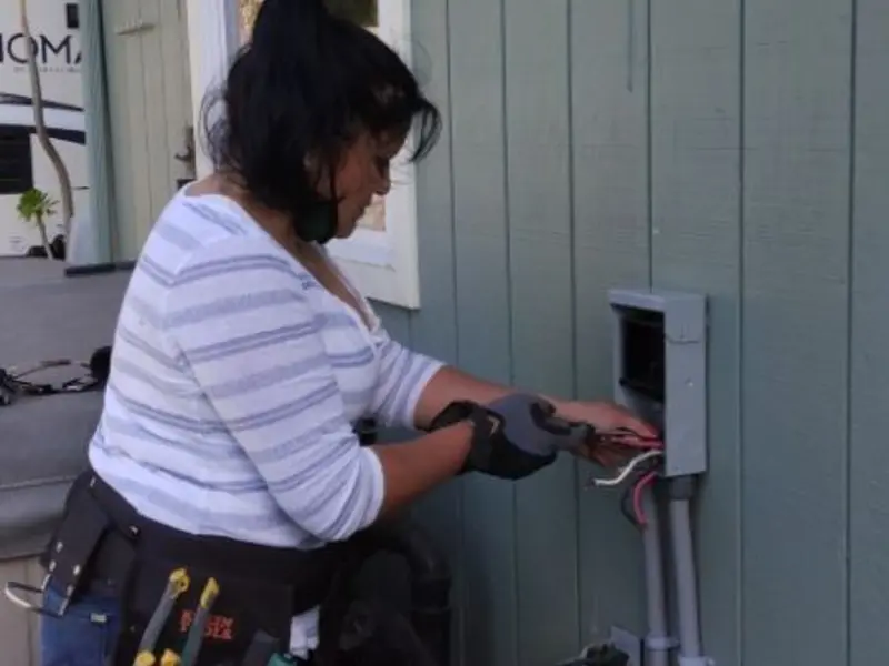 Licensed electrician wiring an exterior subpanel in Powell